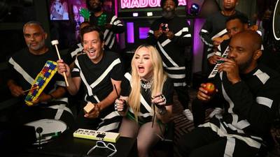 Madonna joins Jimmy Fallon and The Roots for a performance of "Music" using classroom instruments