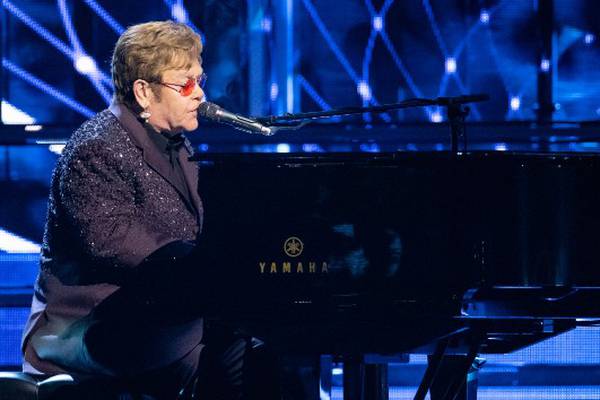 Fans "won't have to wait too long" for new Elton John music, says his husband